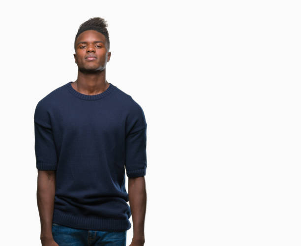 istock Young african american man over isolated background with serious expression on face. Simple and natural looking at the camera. 1043002836