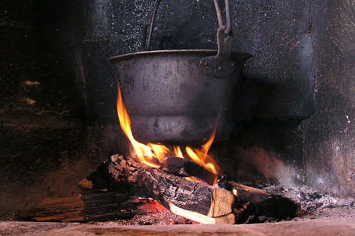 Firewood stack in front of stove.