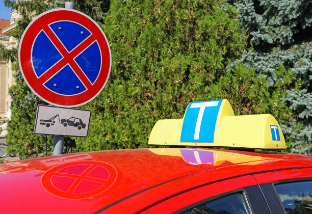 istock Driving student car and do not stop road sign 1043011488