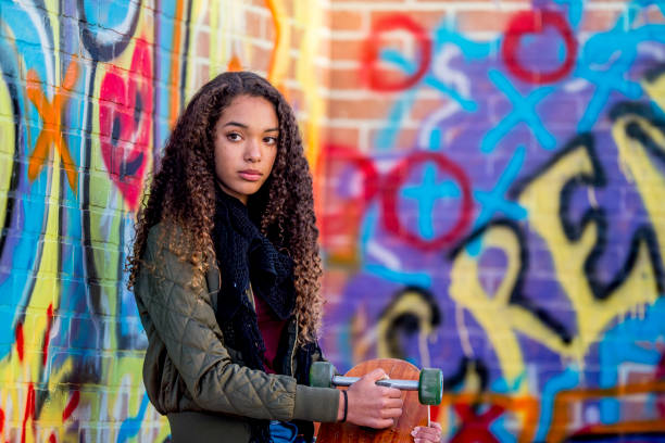 istock Girl Holding Skateboard 1043018828