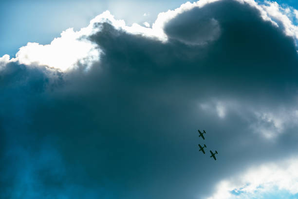 istock Low Angle View Of Airplanes Flying Against Cloudy Sky 1043025772