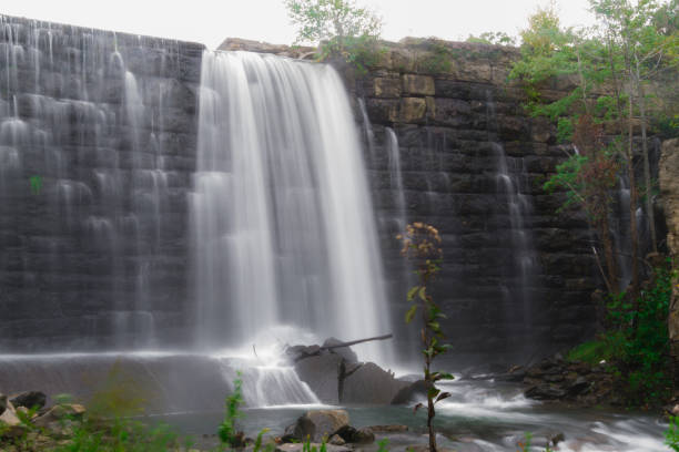 istock Water Flowing Over Dam At Deteriorating Reservoir 1043026228