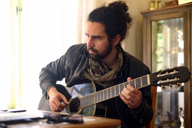 istock Man and Guitar 1043031544