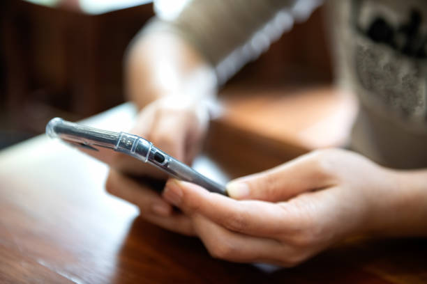 istock Young girl is playing a smartphone. 1043032390