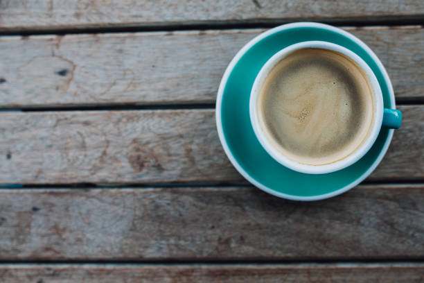 istock Coffee cup on the wooden desk 1043032440