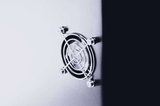 istock Cooling CPU cooler on a dark casing. Cooling fans are illuminated 1043033010
