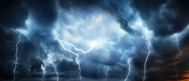 Lightning thunderstorm flash over the night sky. Concept on topic weather, cataclysms (hurricane, Typhoon, tornado, storm)