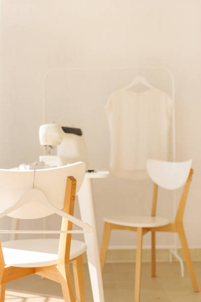 istock Workplace for sewing and needlework in a bright room with white furniture. 1043035522