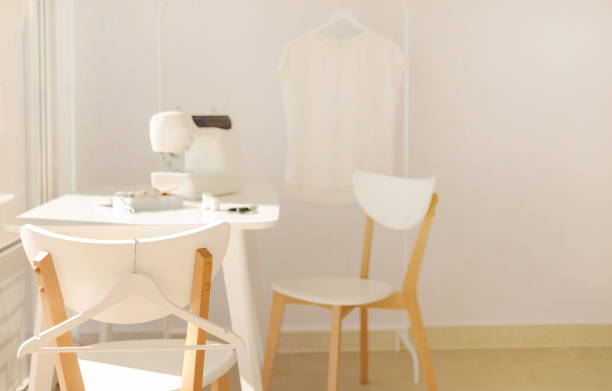 istock Workplace for sewing and needlework in a bright room with white furniture. 1043035528