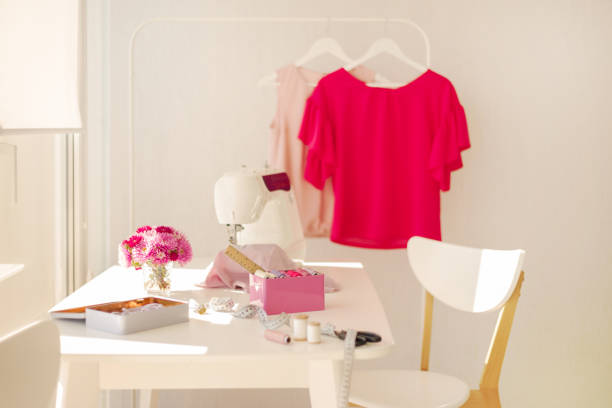 istock Workplace for sewing and needlework in a bright room with white furniture. 1043035534