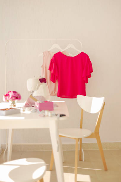 istock Workplace for sewing and needlework in a bright room with white furniture. 1043035536