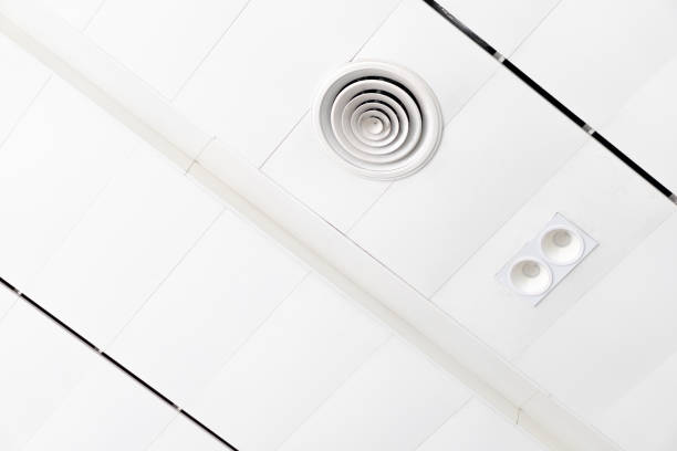 istock White ceiling with neon light bulbs in uprisen view.as background interior decoration concept with copy space for your text or design. 1043035696