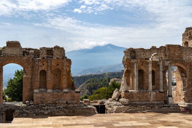 istock Etna volcano with clouds surrounding the mountain top 1043035774