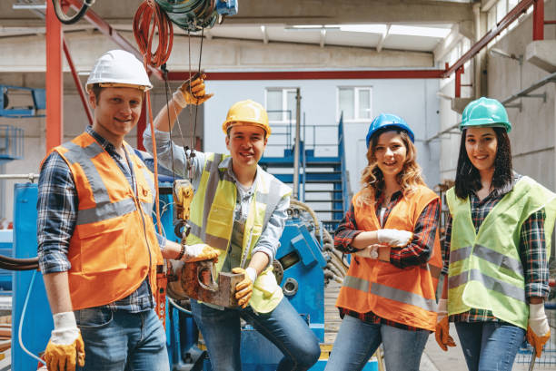 istock Group portrait of industry workers in distribution warehouse 1043040882