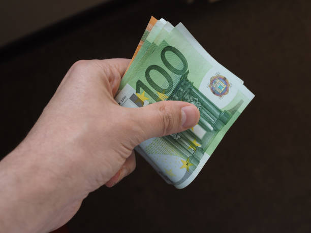 istock Hand with Euro notes, European Union 1043041454