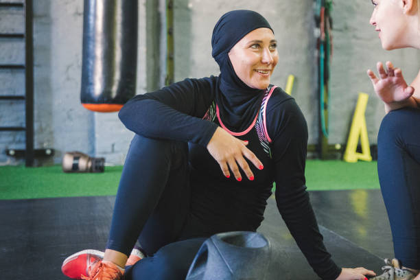 istock Muslim women relaxing after practicing with her trainer 1043048056