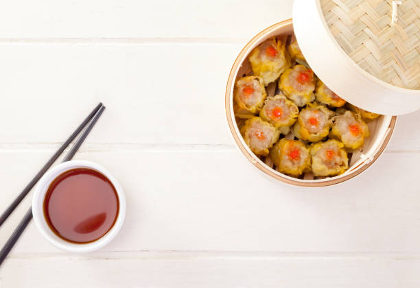 istock Chinese Streamed Dumpling in Bamboo Basket 1043056104