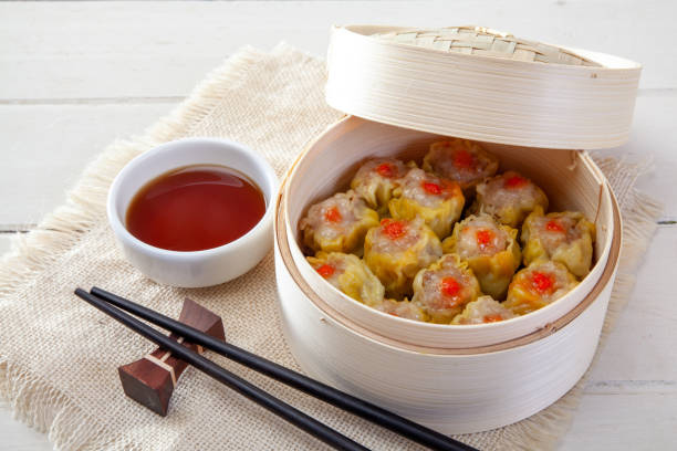 istock Chinese Streamed Dumpling in Bamboo Basket 1043056108