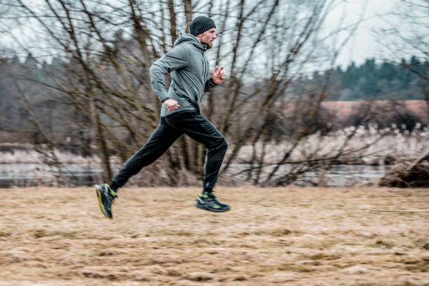 istock Young man running on the field 1043062306