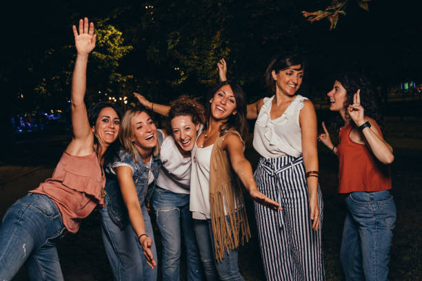 istock Friends having fun together with confetti at a party 1043062494