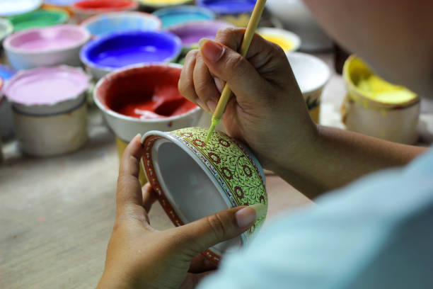 artist painting benjarong ceramic ware stock photo