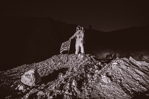 Proud American Astronaut Plant American Flag on the Alien Plane