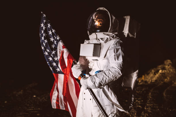 istock Proud American Astronaut Holding American Flag 1043065484