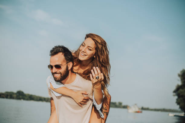 istock Piggyback on the beach 1043070986