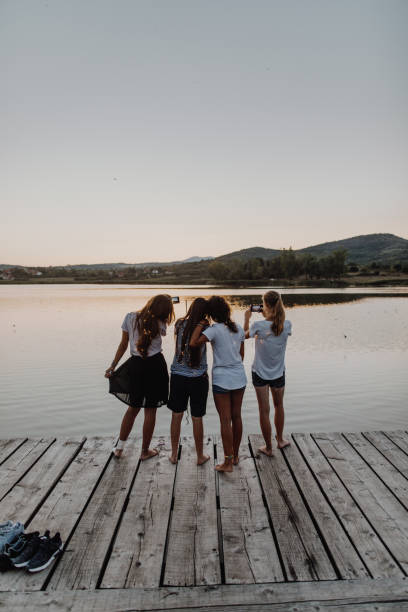 istock Making memories with girlfriends on the lake 1043071552