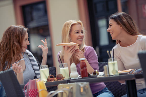 istock Friends enjoying in cafe 1043075290