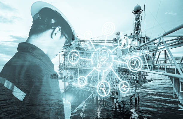 istock Double exposure of Engineer or Technician man with digital icon operated platform or plant by using tablet with offshore oil and gas platform background for industry business concept. 1043075336