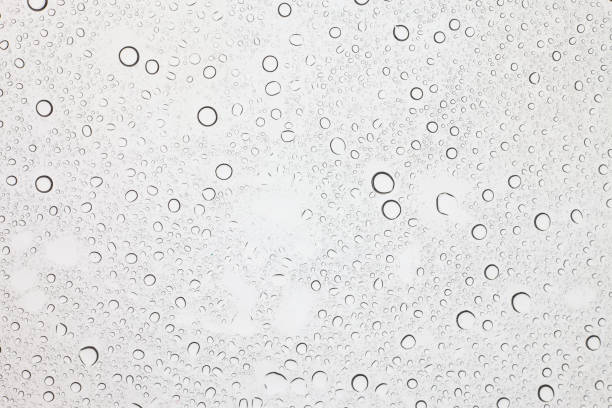 istock Rain droplets on glass background, Water drops on glass. 1043077450