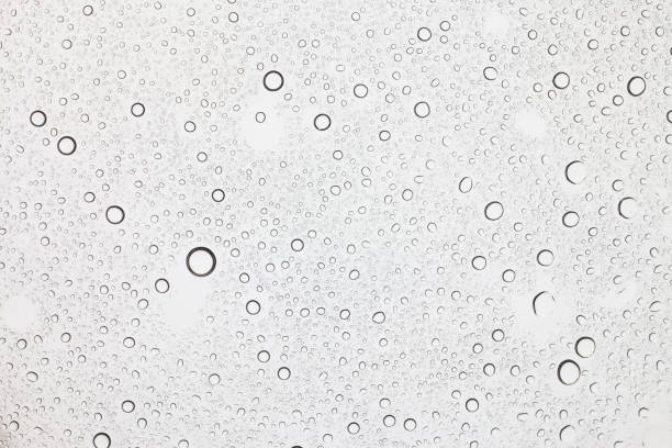 istock Rain droplets on glass background, Water drops on glass. 1043089204