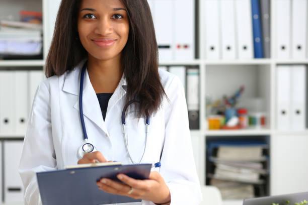 istock Beautiful smiling female doctor hold 1043089374