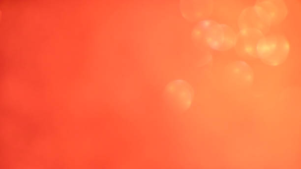 istock Blurred background lights. Abstract defocused gold, white, red and yellow glitters texture. Shining glowing effects 1043092990