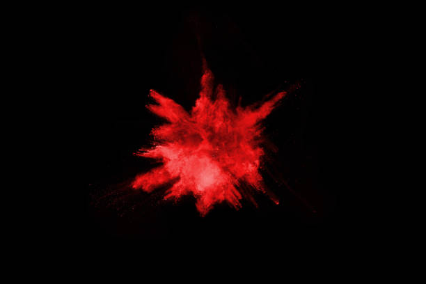istock abstract red powder explosion on black background.abstract red powder splatted on black background. Freeze motion of red powder exploding. 1043100722