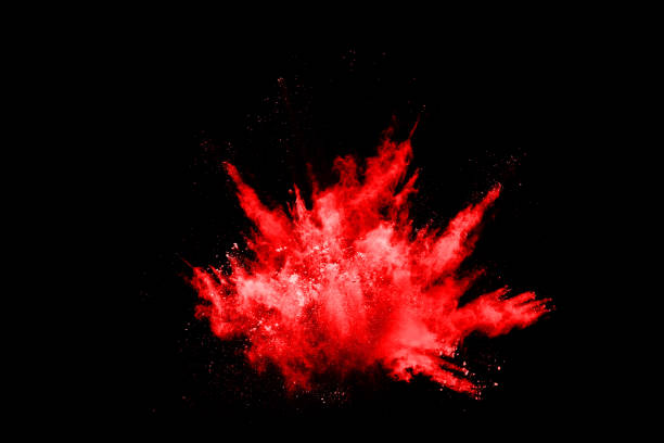 istock abstract red powder explosion on black background.abstract red powder splatted on black background. Freeze motion of red powder exploding. 1043100728