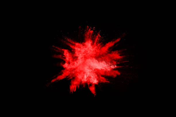 istock abstract red powder explosion on black background.abstract red powder splatted on black background. Freeze motion of red powder exploding. 1043100768