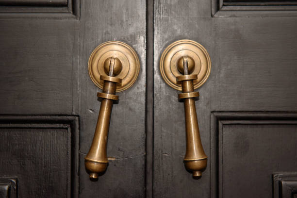 Bronze door handle and wooden door