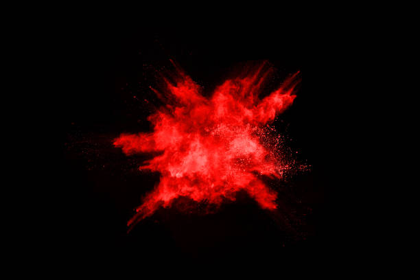 istock abstract red powder explosion on black background.abstract red powder splatted on black background. Freeze motion of red powder exploding. 1043100792