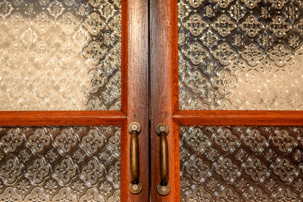 istock Bronze door handle and wooden door 1043101008