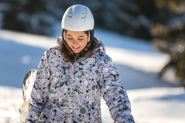 istock Beautiful female snowboarder 1043109746