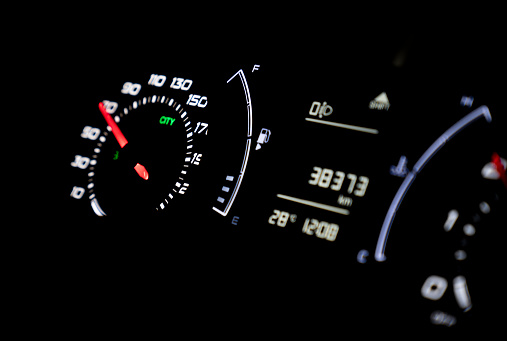 Modern light car mileage on black background 70 mph