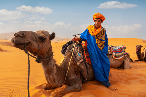 Berber man at sunset in the desert of Merzouga, Morocco