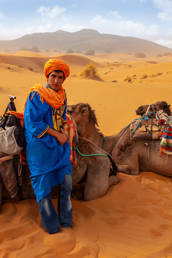 Berber man at sunset in the desert of Merzouga, Morocco