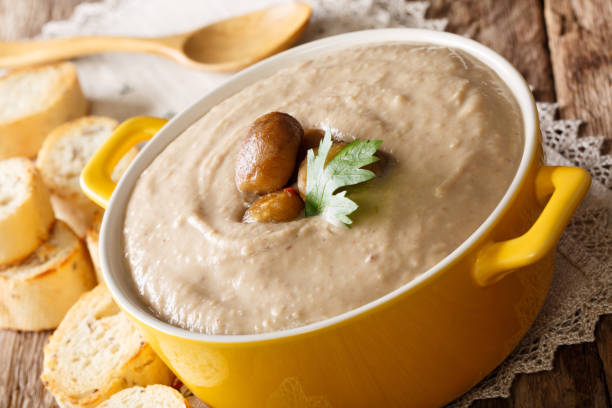 istock Freshly prepared cream chestnut soup with toasted bread closeup in a pot. horizontal 1043127940