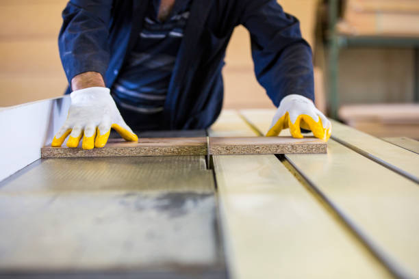 istock Carpenter Working with Wooden Planks at Work 1043132494
