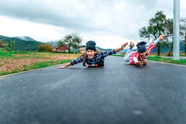 istock Little cool girls with skateboards 1043135300