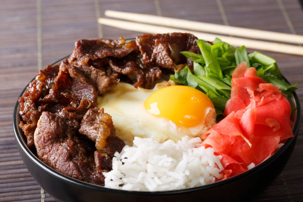 istock Homemade beef with rice, egg and onion close-up in a bowl on the table. horizontal 1043136042
