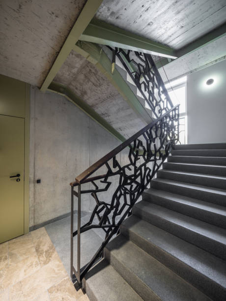 istock Staircase, staircase in a modern house. Iron decorative railings. 1043141092